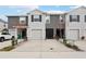 Modern townhouses with attached garages and landscaping at 5278 Dragonfly Dr, Wildwood, FL 34785