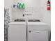 Laundry room with washer, dryer, and shelving at 5278 Dragonfly Dr, Wildwood, FL 34785