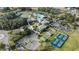 Aerial view of community with clubhouse, pool, and tennis/pickleball courts at 5318 Fantasy Way, Leesburg, FL 34748