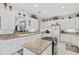 Spacious kitchen with island and white cabinets at 5318 Fantasy Way, Leesburg, FL 34748