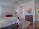 Spacious bedroom with built-in cabinetry and hardwood floors at 581 Society Hill Cir, The Villages, FL 32162