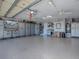 Organized garage with storage cabinets and epoxy flooring at 581 Society Hill Cir, The Villages, FL 32162