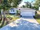 Front yard view of a newly remodeled home with driveway at 808 E Orange St, Apopka, FL 32703