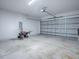 Spacious garage with an overhead door and extra room for storage at 808 E Orange St, Apopka, FL 32703