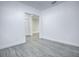 Gray floor hallway with white walls and doors at 808 E Orange St, Apopka, FL 32703