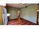 Bright bedroom with hardwood floors and a ceiling fan at 819 Edgewater Dr, Eustis, FL 32726