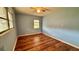 Bedroom with hardwood floors and ceiling fan at 819 Edgewater Dr, Eustis, FL 32726