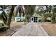 Cute bungalow with a screened porch and a spacious driveway at 819 Edgewater Dr, Eustis, FL 32726