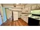 Small kitchen with white cabinets and a white refrigerator at 819 Edgewater Dr, Eustis, FL 32726