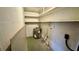 Small laundry area with water heater and shelving for storage at 819 Edgewater Dr, Eustis, FL 32726