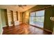 Living room with hardwood floors, built-in shelves, and a window at 819 Edgewater Dr, Eustis, FL 32726