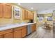 Eat-in kitchen with ample counter space and wood cabinets at 860 Evelynton Loop, The Villages, FL 32162