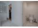 Small bathroom with toilet and access to closet at 963 Hart Dr, The Villages, FL 32163