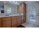 Elegant bathroom boasts a spacious vanity with ample storage and an exterior access at 963 Hart Dr, The Villages, FL 32163