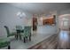 Charming dining room with a glass-top table and four patterned chairs at 963 Hart Dr, The Villages, FL 32163