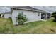 Exterior view of the house with well-maintained lawn and landscaping at 963 Hart Dr, The Villages, FL 32163