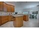 Well-appointed kitchen island and ample cabinetry at 963 Hart Dr, The Villages, FL 32163