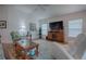 Bright living room with hardwood floors and large windows at 963 Hart Dr, The Villages, FL 32163