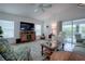 Relaxing living room with vaulted ceilings and hardwood floors at 963 Hart Dr, The Villages, FL 32163