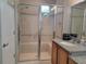 Bathroom with walk-in shower and built-in seating at 97 Bayou Bend Rd, Groveland, FL 34736