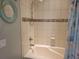 Clean bathroom with a shower and updated fixtures at 97 Bayou Bend Rd, Groveland, FL 34736