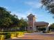 Gated community entrance to Trilogy with landscaping at 97 Bayou Bend Rd, Groveland, FL 34736