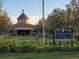 Magnolia House community clubhouse with landscaping at 97 Bayou Bend Rd, Groveland, FL 34736