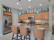 Well-equipped kitchen featuring stainless steel appliances and island at 97 Bayou Bend Rd, Groveland, FL 34736