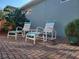 Relaxing patio with seating and brick pavement at 97 Bayou Bend Rd, Groveland, FL 34736