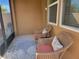 Relaxing screened patio with wicker furniture at 97 Bayou Bend Rd, Groveland, FL 34736