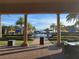 Resort-style pool area with palm trees and umbrellas at 97 Bayou Bend Rd, Groveland, FL 34736