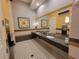 Modern restroom with granite countertops and tiled floors at 97 Bayou Bend Rd, Groveland, FL 34736