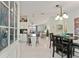 Open concept dining area with kitchen and living room views at 1007 Dustin Dr, The Villages, FL 32159
