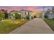 Attractive single-story home with landscaped lawn and driveway at 1007 Dustin Dr, The Villages, FL 32159