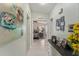 Hallway with light walls and a view into a bedroom at 1007 Dustin Dr, The Villages, FL 32159