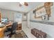 Home office features built-in desk, window, and decorative wall at 1007 Dustin Dr, The Villages, FL 32159