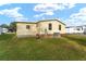 Well-maintained home exterior with neat lawn at 1007 Dustin Dr, The Villages, FL 32159