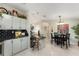 Kitchen features granite countertops, light cabinets, and a breakfast bar at 1007 Dustin Dr, The Villages, FL 32159