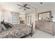 Main bedroom with sliding barn door and dresser at 1007 Dustin Dr, The Villages, FL 32159