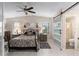 Main bedroom with wood floors and a view of the bathroom at 1007 Dustin Dr, The Villages, FL 32159