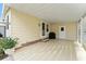 Covered patio with storage and grill area at 1007 Dustin Dr, The Villages, FL 32159