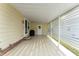 Covered patio with storage and privacy screen at 1007 Dustin Dr, The Villages, FL 32159