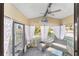 Cozy screened porch, perfect for relaxing and enjoying the outdoors at 1007 Dustin Dr, The Villages, FL 32159