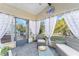 Relaxing screened porch with seating and outdoor views at 1007 Dustin Dr, The Villages, FL 32159