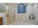 Bathroom features walk-in shower and walk-in tub at 102 Camino Real Blvd # 102, Howey In The Hills, FL 34737