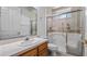 Bathroom with walk-in shower and toilet at 102 Camino Real Blvd # 102, Howey In The Hills, FL 34737