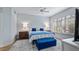 Comfortable bedroom with a queen-size bed, nightstands, and a blue bench at 102 Camino Real Blvd # 102, Howey In The Hills, FL 34737