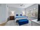 Bright bedroom with ample natural light and blue accents at 102 Camino Real Blvd # 102, Howey In The Hills, FL 34737