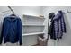 Well-organized closet with shelves and hanging space at 102 Camino Real Blvd # 102, Howey In The Hills, FL 34737