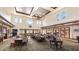 Spacious clubhouse lobby with seating and chandelier at 102 Camino Real Blvd # 102, Howey In The Hills, FL 34737
